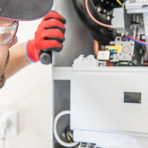 Technician checking a furnace